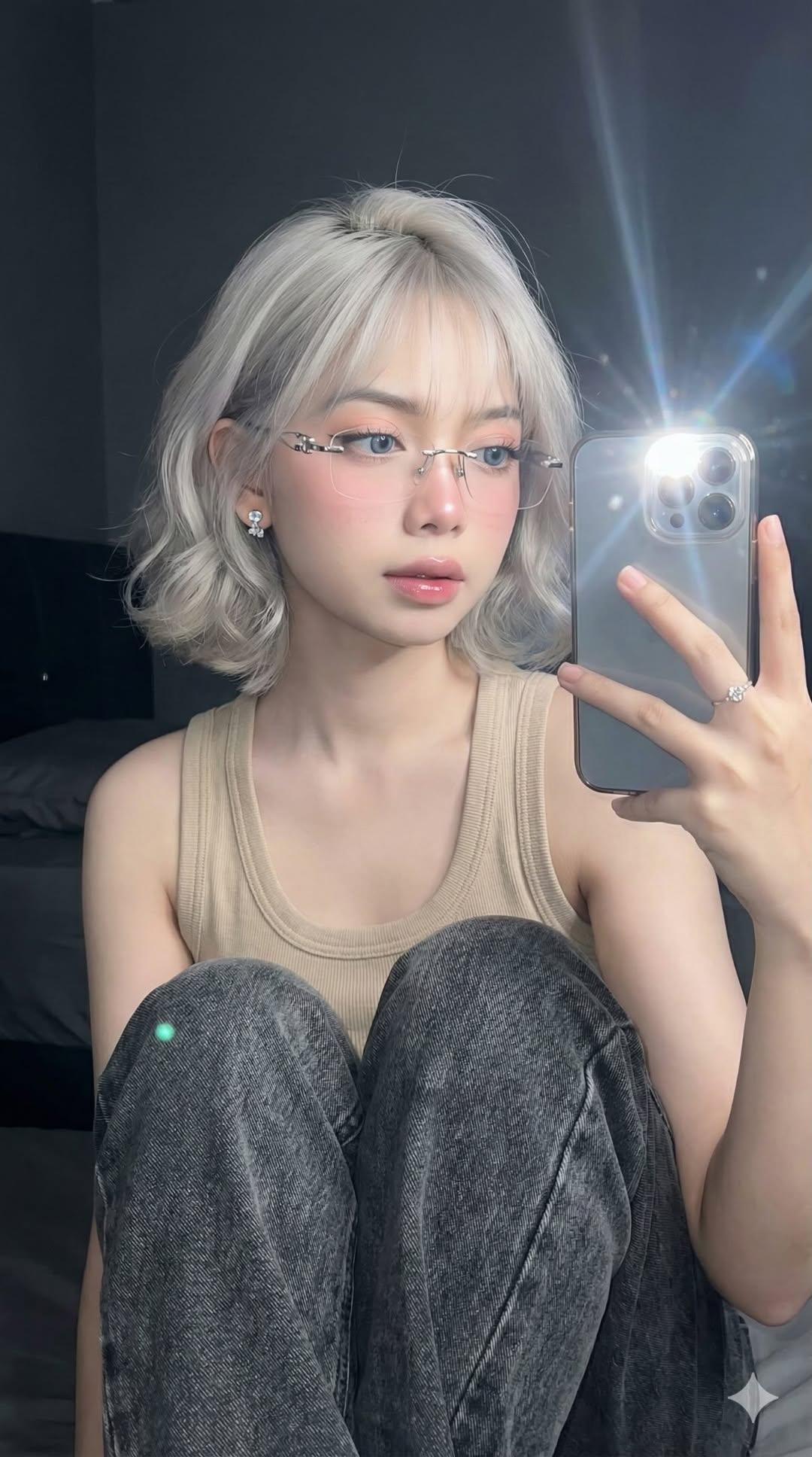 Mirror Selfie of a Young Woman with Soft Glam Makeup